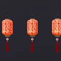 Three Red Lanterns With Gold Patterns And Red Tassels On Black Background