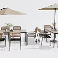 Outdoor Rattan Table And Chair Set With Umbrella And Decorative Flowers