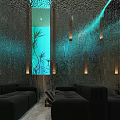 Modern Lounge Area Interior With Black Sofas Blue Lit Stone Walls And Aquarium Plants