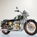 Vintage Dark Green Motorcycle With Black Seat Orange Rims And Chrome Accents
