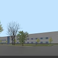 Modern Industrial Factory Building With Surrounding Green Trees And Clear Blue Sky