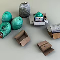 Green And Gray Garbage Bags With Open Cardboard Boxes And Waste Items