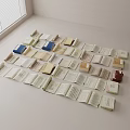 Open Books and Magazines Scattered on Light Colored Tabletop With Various Colors