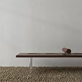 Modern Wooden Bench With Transparent Legs On Pebble Ground Against Gray Wall And Cylindrical Object