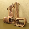 Wooden Single Chair Featuring Unique Curved Design And Natural Texture Against Light Colored Wall