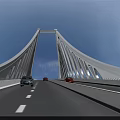 Modern White Cable Stayed Bridge With Cars Driving On Road Under Clear Blue Sky