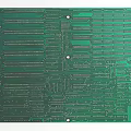 Detailed Green Printed Circuit Board With Intricate Circuitry And Mounting Holes