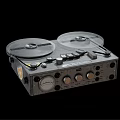 Vintage Reel to Reel Tape Recorder with Silver Metal Body and Control Knobs