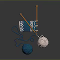 Knitting Supplies With Blue Pink Yarn Balls Wooden Needles And Blue Patterned Fabric