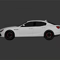 Silver Maserati Sedan With Sleek Design And Black Wheels On Reflective Surface