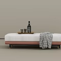 White Upholstered Sofa Bench With Pink Base Gold Legs Tray Bottle Glasses And Plaid Blanket