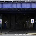 Brick Arch Road Tunnel Entrance With Historical Brick Structure And Signage