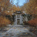Traditional Chinese Gateway With Classic Roof Plaque And Golden Autumn Leaves Around Stone Walls