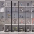 Various Action Figures Displayed in Glass Door Cabinet with Multiple Shelves and Indoor Potted Plant