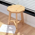 Natural Wooden Stool With Octagonal Seat And Crossed Legs In Modern Home Interior
