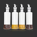 White Condiment Bottles with Dispenser Tops Containing Various Colored Liquids