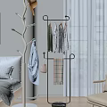 Modern Clothes Rack With Hanging Clothes Handbag And Plaid Blanket In Bedroom