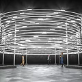 Striking Modern Art Installation With Illuminated Concentric Circular Rings And Visitors