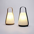 Conical Paper Shade Table Lamps With Light Wood And Black Handle Illuminated