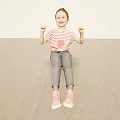 Smiling Red Haired Girl In Striped Shirt Sitting On Light Ground With Raised Fists