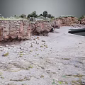 Natural Coastal Terrain With Red Rock Cliffs Sandy Beach Stones And Vegetation