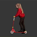 Child Riding Red Scooter In Red Sweater And Brown Pants On Gray Background