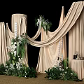 Elegant Floral Installation Featuring Beige Drapes White Flowers And Lush Greenery