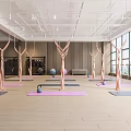 Spacious Aerial Yoga Studio With Pink Hammocks Yoga Mats And Kettlebells