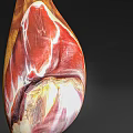 Suspended Cured Ham Leg With Marbled Meat And Fat On Dark Background
