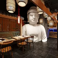 Traditional Asian Restaurant Interior With Large Buddha Statue Wooden Tables And Hanging Lanterns