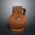 Artisanal Carved Terracotta Pitcher With Intricate Floral Patterns And Handle