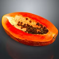 Fresh Sliced Papaya with Vibrant Orange Flesh and Black Seeds on Gray Background