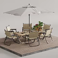 Stylish Outdoor Table Set with Chairs Umbrella on Wooden Deck and Potted Plants