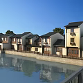 Traditional Chinese Style Commercial Street Along Riverside With White Walls Black Tiles And Water Reflections