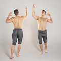 Shirtless Man Showing Muscles In Gray Compression Shorts With Raised Arms