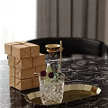 Stacked Brown Paper Boxes With Glassware Golden Funnel And Gold Tray On Marble Tabletop