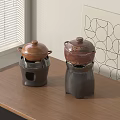 Ceramic Cookware with Lids on Wooden Kitchen Table Near Window Blinds and Geometric Wall Art