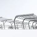 Row of Modern Bicycle Parking Canopies With Transparent Roof Structure