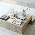 Modern Stone Coffee Table With Books Tray Vase Branches And White Bottles