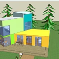 Modern Colorful Office Building With Large Glass Windows And Surrounding Trees