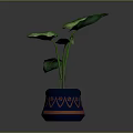Vibrant Green Leafy Plant in Blue Pot with Orange Decorative Patterns