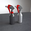 Industrial Spray Bottles With Red Nozzles In Gray And White On Gray Tabletop