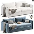 White and Blue Two-Seater Sofa with Knit Blanket Throw Pillows and Decorative Balls