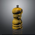 Yellow Wooden Pepper Grinder With Wood Grain And Metal Top Knob On Black Surface