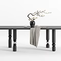 Black Dining Table With Spherical Legs Vase White Flowers And Gray Cloth