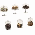 Assorted Cookies And Pastries Displayed In Glass Domes And Jars With Lids
