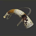 Horn Shaped Silver Carved Sculpture With Orange Accent And Braided Details