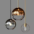 Modern Spherical Glass Pendant Lights With Gold Metal Frames And Illuminated Glow