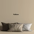 Poliform Decorative Pillows in Brown Beige and Light Gray Arranged Against Light Beige Wall