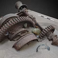 Scenic Landscape Featuring Rusted Metal Gears and Machinery Parts on Sandy Ground with Stones